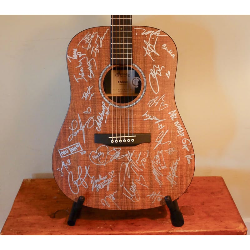 Image of Win a Martin Guitar Signed by MUNA, Jack Antonoff, Reneé Rapp, Janelle Monáe, Laufey and more All Things Go Artists